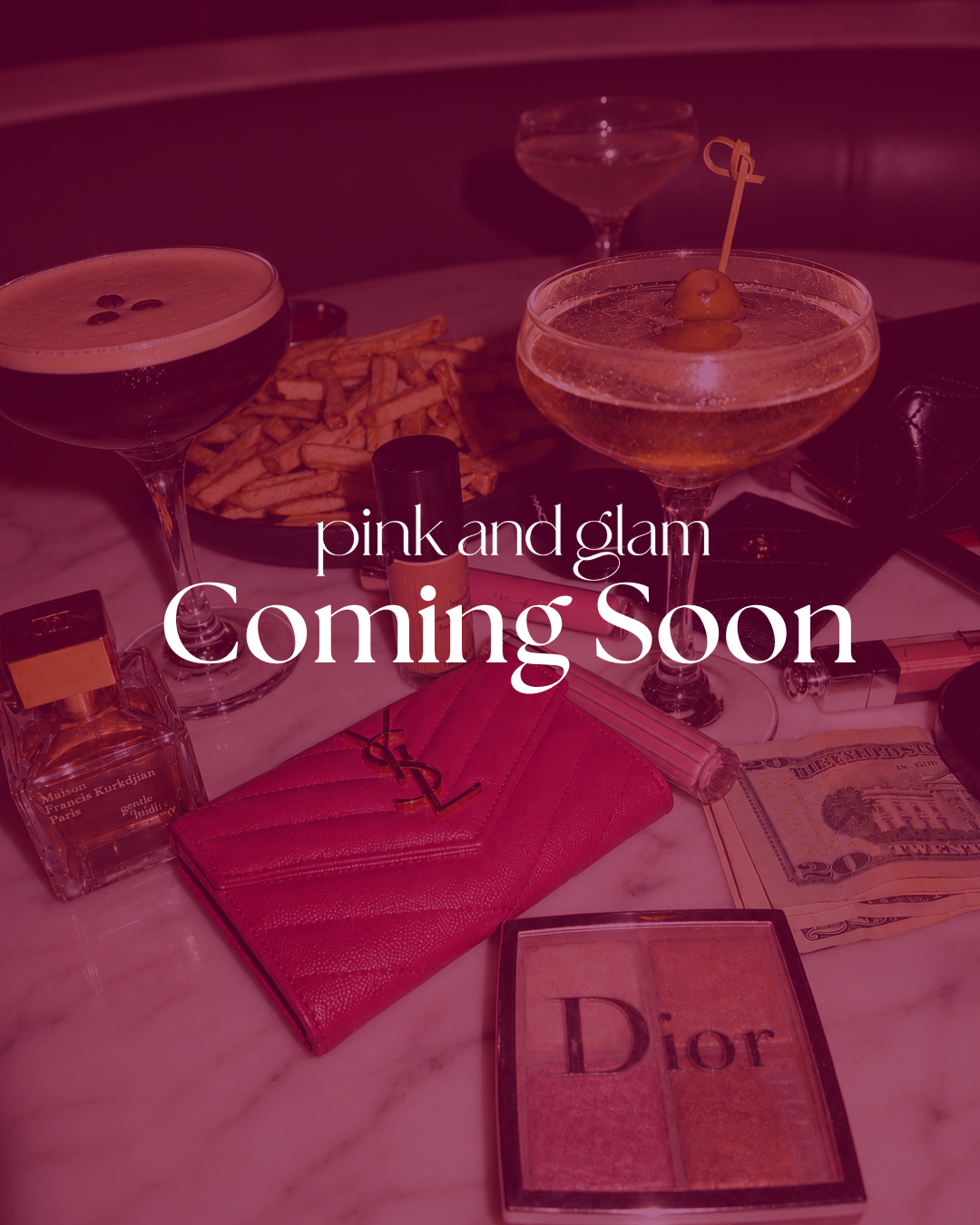 Cocktails, fragrance and beauty products on a marble table